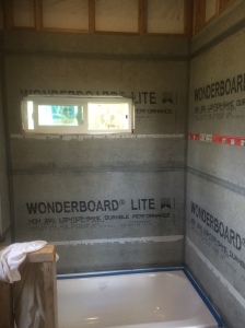 As you might recall, we left for WA after putting up the concrete backerboard around the tub.